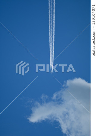 A blue sky with an aircraft A blue sky with an aircraft 129104071