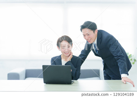 Business person using a computer in the office Business person using a computer in the office 129104189