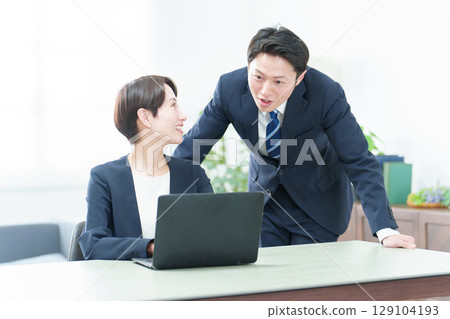 Business person using a computer in the office 129104193