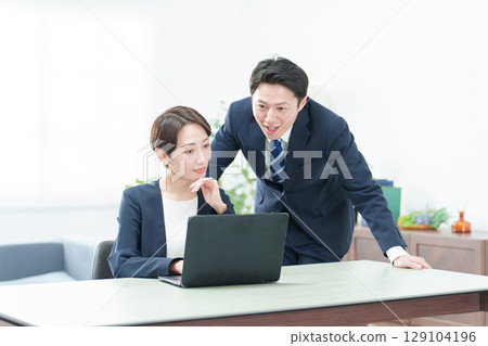 Business person using a computer in the office Business person using a computer in the office 129104196