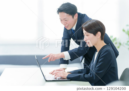 Business person using a computer in the office 129104200