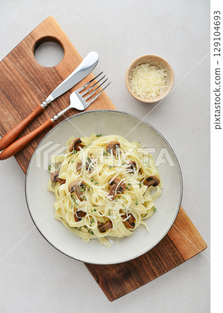 Mushroom pasta with cream parmesan cheese 129104693