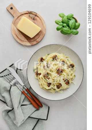 Mushroom pasta with cream parmesan cheese Mushroom pasta with cream parmesan cheese 129104699