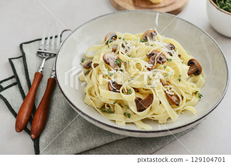 Mushroom pasta with parmesan cheese Mushroom pasta with parmesan cheese 129104701