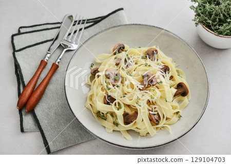 Mushroom pasta with parmesan cheese Mushroom pasta with parmesan cheese 129104703