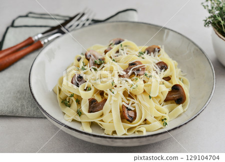 Mushroom pasta with parmesan cheese Mushroom pasta with parmesan cheese 129104704