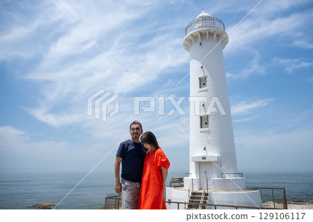 Couple traveling to Nomazaki Lighthouse in summer 129106117