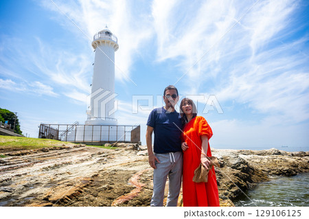 Couple traveling to Nomazaki Lighthouse in summer Couple traveling to Nomazaki Lighthouse in summer 129106125