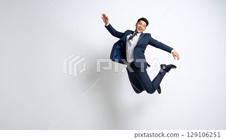 Businessman flying in the sky 129106251