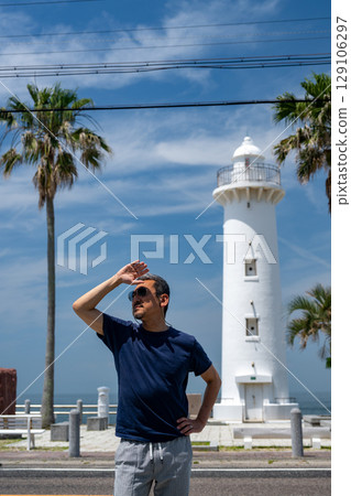 A handsome man traveling around the chalk-white Nomazaki Lighthouse A handsome man traveling around the chalk-white Nomazaki Lighthouse 129106297