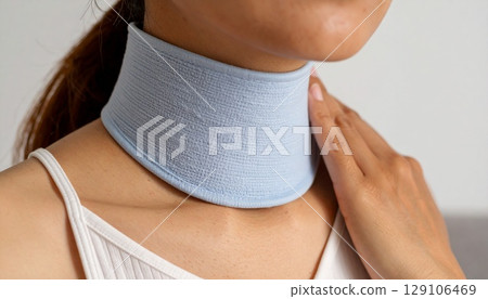 A woman looking cool with a neck cooler around her neck 129106469