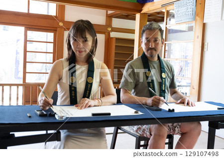 Couples copying sutras at Iwaya-ji Temple in Chita, Aichi Couples copying sutras at Iwaya-ji Temple in Chita, Aichi 129107498