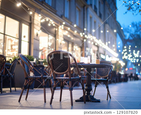 Stylish cafe at night Illuminated landscape Cafe Exterior Terrace City Street Night 129107820