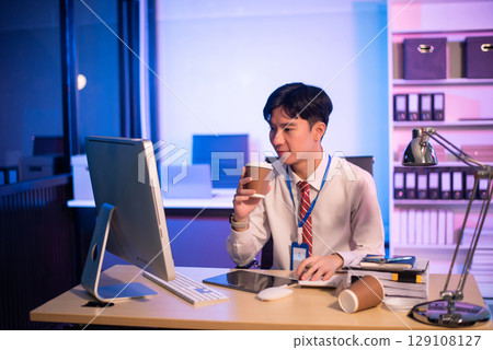 Overworked young Asian businesswoman office worker suffering from neck pain after had a long day at her office desk. Overworked young Asian businesswoman office worker suffering from neck pain after had a long day at her office desk. 129108127