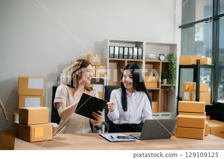 Starting small businesses SME owners, two check online orders Selling products working with boxs freelance work 129109125