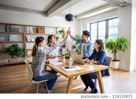 Business team celebrating the success of a project Business team celebrating the success of a project 129110071