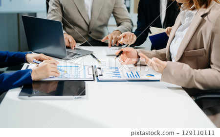 Business team collaboration discussing working analyzing with financial data and marketing growth report graph Business team collaboration discussing working analyzing with financial data and marketing growth report graph 129110111
