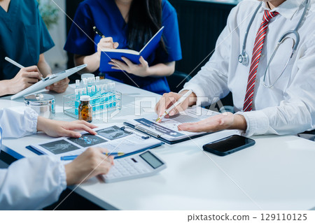 Medical technology network team meeting concept. Doctor hand working with smart phone modern digital tablet and laptop Medical technology network team meeting concept. Doctor hand working with smart phone modern digital tablet and laptop 129110125