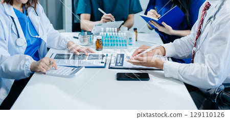 Medical technology network team meeting concept. Doctor hand working with smart phone modern digital tablet and laptop Medical technology network team meeting concept. Doctor hand working with smart phone modern digital tablet and laptop 129110126