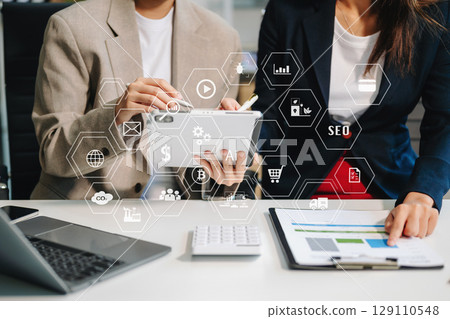 Business team partnership meeting concept. Business hand using laptop, tablet and smartphone in office. Digital marketing media mobile app in virtual icon Business team partnership meeting concept. Business hand using laptop, tablet and smartphone in office. Digital marketing media mobile app in virtual icon 129110548