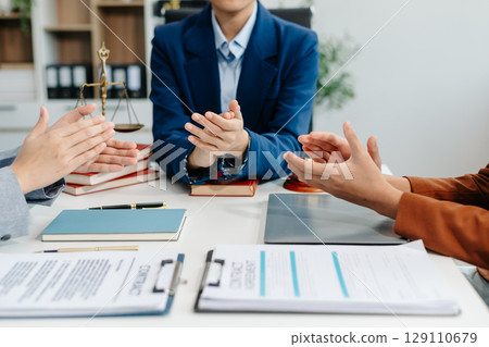 Asian team and lawyers discussing contract papers coworker, teamwork celebrating achievement.Concepts Asian team and lawyers discussing contract papers coworker, teamwork celebrating achievement.Concepts 129110679