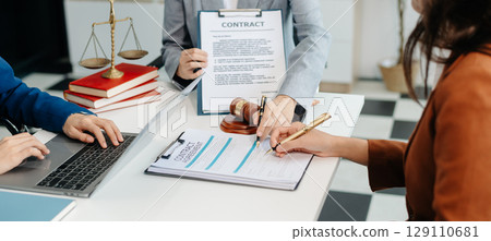 Asian team and lawyers discussing contract papers coworker, teamwork celebrating achievement.Concepts 129110681