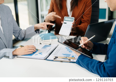 Two young businesswomen working new start up project Laptop computer and digital tablet and smart phone 129110703
