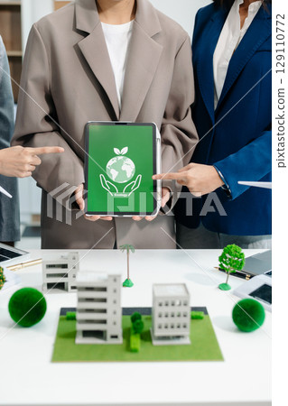 business team people planning and discussing on recycle reduce reuse policy symbol in office meeting room. 129110772