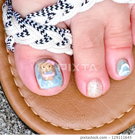 Elegant toenail art featuring soft pastel tones with floral and glitter accents. A perfect blend of style and charm, adding a touch of beauty and sophistication to every step. Elegant toenail art featuring soft pastel tones with floral and glitter accents. A perfect blend of style and charm, adding a touch of beauty and sophistication to every step. 129111645