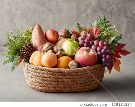 A basket of fruit and vegetables filled with autumn bounty 129111823