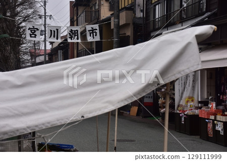 Takayama City, Gifu Prefecture, Japan - Miyagawa Morning Market, a tourist attraction, with stalls selling local specialties and a shopping street - morning scene during the Takayama Spring Festival Takayama City, Gifu Prefecture, Japan - Miyagawa Morning Market, a tourist attraction, with stalls selling local specialties and a shopping street - morning scene during the Takayama Spring Festival 129111999