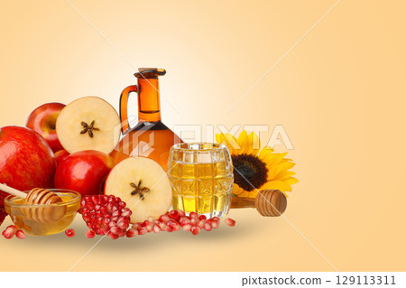 Bright display of fresh fruits, honey, and juice Bright display of fresh fruits, honey, and juice 129113311