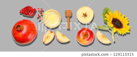 Colorful fruits and honey create a beautiful display with sunflower Colorful fruits and honey create a beautiful display with sunflower 129113315