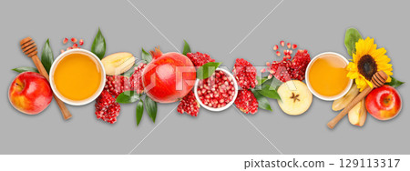 Autumn harvest: apples, pomegranates, honey, and sunflowers Autumn harvest: apples, pomegranates, honey, and sunflowers 129113317