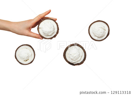 Hand holding creamy coconut halves, isolated on white, PNG Hand holding creamy coconut halves, isolated on white, PNG 129113318