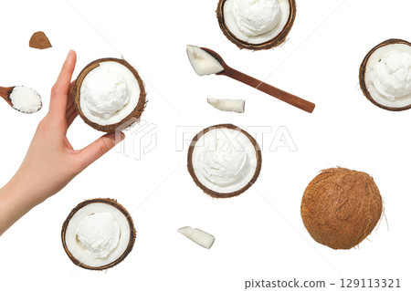 Coconut shells with smooth dessert inside, isolated on white, PNG 129113321