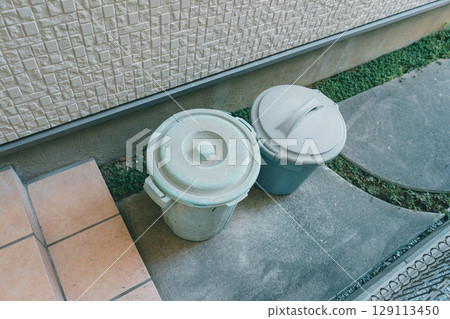 Plastic buckets in a garbage dump 129113450