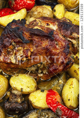 Delicious baked pork, food background. 129113589