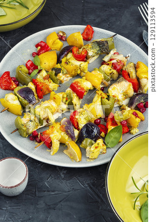 Grilled fish skewers, healthy meal. 129113594
