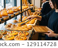Woman choosing bread 129114728