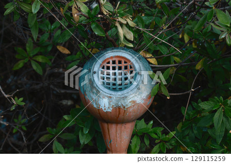 A tasteful ashtray placed in the garden A tasteful ashtray placed in the garden 129115259
