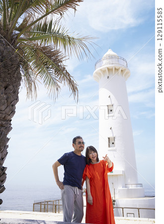 A friendly couple enjoying sightseeing 129115585