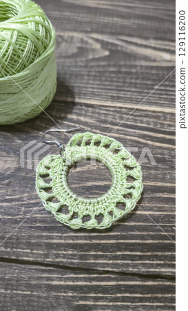 Round green earrings made of thin cotton threads, hand-knitted. Handmade. 129116200