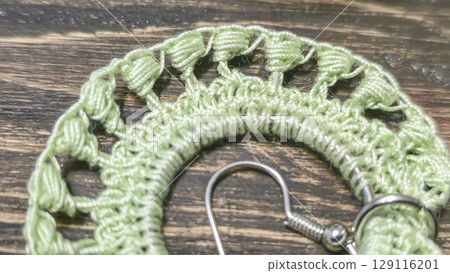 Round green earrings made of thin cotton threads, hand-knitted. Handmade. 129116201