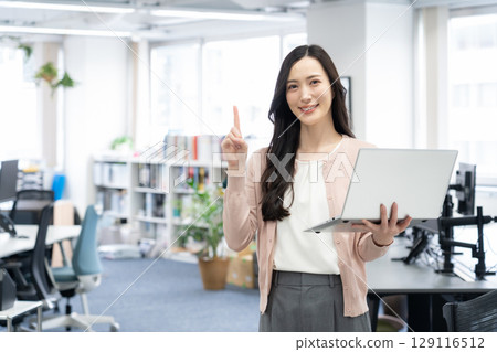 Young female engineer in office casual wear Young female engineer in office casual wear 129116512