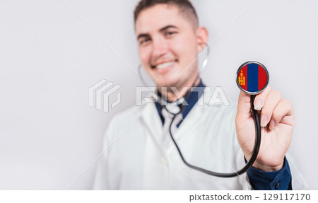 Doctor showing stethoscope with Mongolia flag. Mongolia national healthcare concept Doctor showing stethoscope with Mongolia flag. Mongolia national healthcare concept 129117170