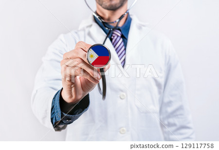 Philippines healthcare system, doctor holding stethoscope. Philippines health and medical insurance concept 129117758