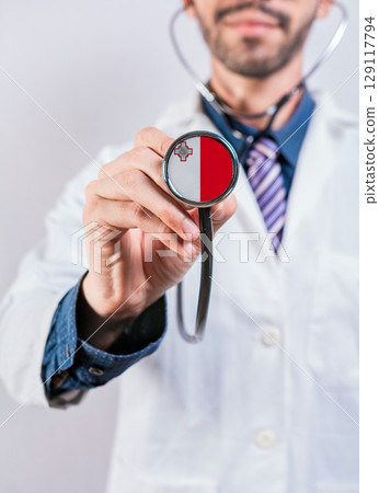 Malta health and medical insurance concept. Malta healthcare system, doctor holding stethoscope Malta health and medical insurance concept. Malta healthcare system, doctor holding stethoscope 129117794