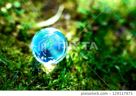 Beautiful backlit globe crystal. Ecological image. Blue morning color. 129117871