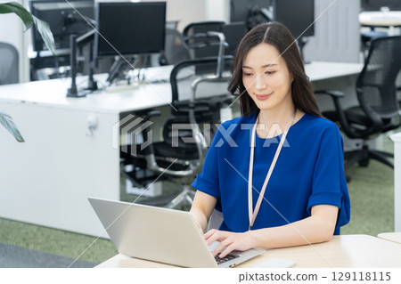 Young female engineer in office casual wear Young female engineer in office casual wear 129118115